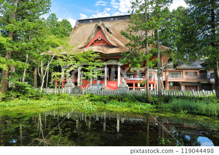 Haguro-san and Dewa-sanzan: View of the Sanshin-gosaiden across Kagami-ike Pond 119044498