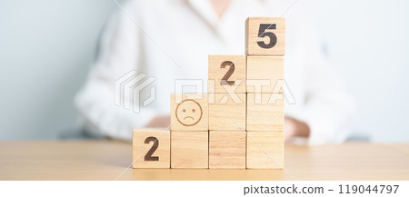Happy New Year 2025 with Sad face block. Satisfaction, feedback, Review, mental health, eco sustainable and bad year concept Happy New Year 2025 with Sad face block. Satisfaction, feedback, Review, mental health, eco sustainable and bad year concept 119044797