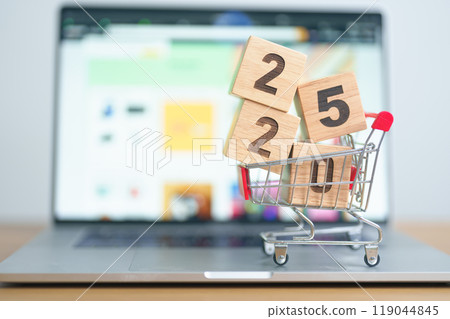 Happy new year with 2025 block in shopping trolley cart on table. E commerce, online shopping, finance, consumer economy and celebration concepts 119044845