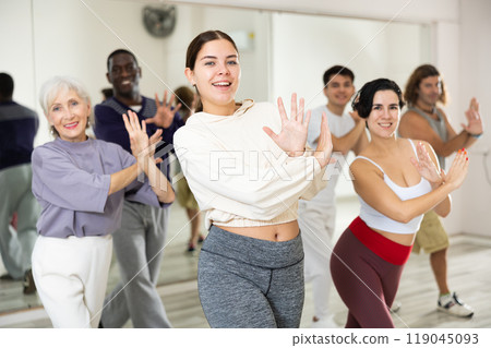 Group of people practicing energetic lindy hop movements 119045093