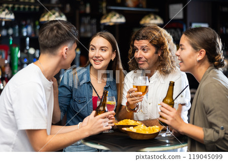 Friendly people spending time in pub 119045099