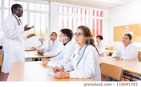 Young woman medical student attending lecture in university 119045785