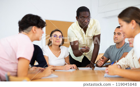 Diverse people studying on language courses Diverse people studying on language courses 119045848