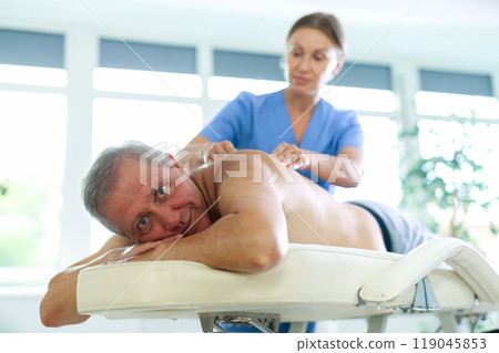 male patient having massage 119045853