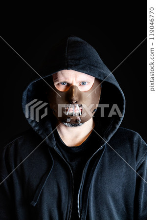 Thug wearing a bite mask Thug wearing a bite mask 119046770