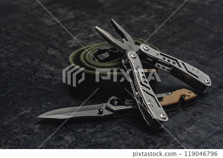 Folding knife with functional tool with tactical belt. Set of men's tools and accessories. 119046796