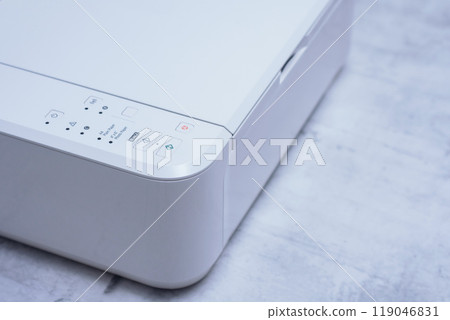 White printer for printing and scanning documents, close-up on a marble table. 119046831