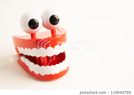 Tooth funny toy denture red color jaw and eye. 119048789