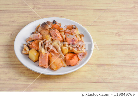 Salmon and potato stir-fry in butter 119049769