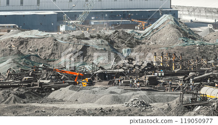 Aerial View On Truck Crane Unloads Metal Structures And Concrete Blocks. Heavy Vehicles At Work At A Construction Site. Men At Work. Piles Of Rubble And Stone For Road Construction. Construction Of Aerial View On Truck Crane Unloads Metal Structures And Concrete Blocks. Heavy Vehicles At Work At A Construction Site. Men At Work. Piles Of Rubble And Stone For Road Construction. Construction Of 119050977