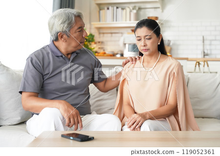 Asia senior elderly man comforting him wife after having problems relationship 119052361