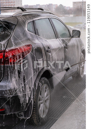 SUV Being Washed at Car Wash 119053149