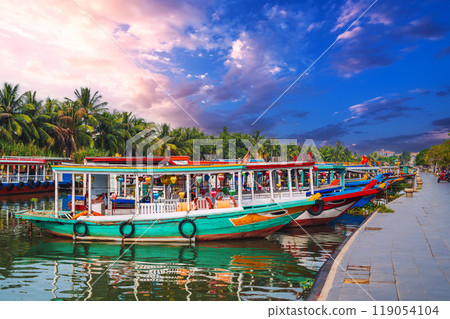 Traditional Vietnamese boats on the Thu bon river in old town in Hoi An in Vietnam 119054104