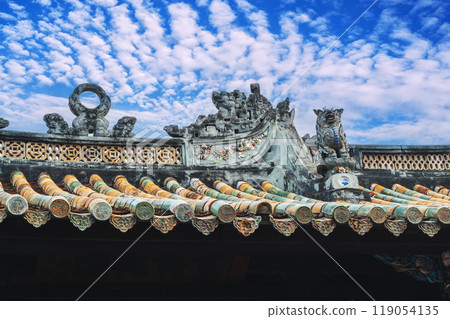 Ancient traditional Asian tiled roof of Buddhist temple in Vietnam in Asia 119054135