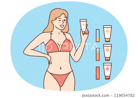 Woman in beach tanning bikini demonstrates anti-sunburn cream for visiting solarium 119054782