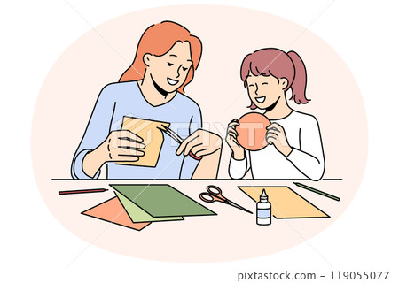 Smiling mother and daughter enjoy arts and crafts 119055077