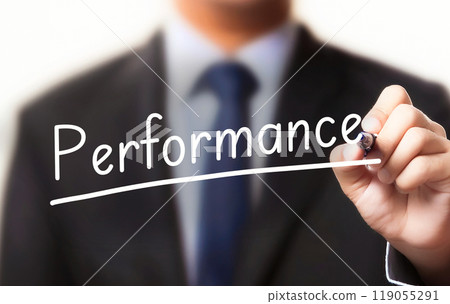 Businessman writing the word performance 119055291