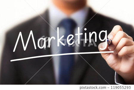 Businessman writing the word marketing 119055293