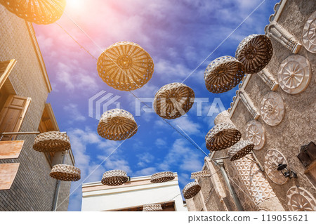 Close-up of rattan hanging ornaments on an old Arab street. 119055621