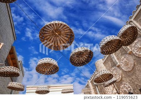 Close-up of rattan hanging ornaments on an old Arab street. 119055623