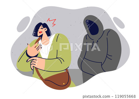 Stalker stalks woman, hiding face under hood, in order to commit crime and steal purse 119055668