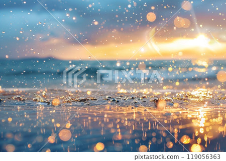 Golden Sunset Reflections and Sparkling Water Droplets on a Tranquil Beach 119056363