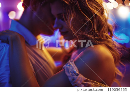 Romantic Couple Dancing Close at Night Club Under Soft Colorful Lighting Romantic Couple Dancing Close at Night Club Under Soft Colorful Lighting 119056365