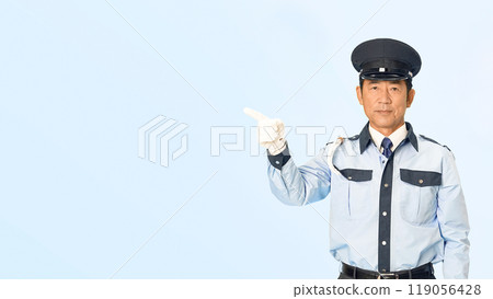 A male security guard pointing and guiding A male security guard pointing and guiding 119056428