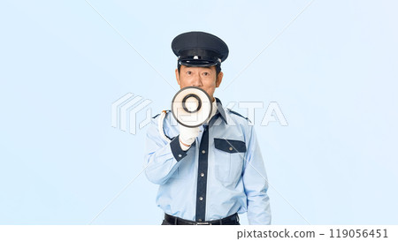 A male security guard using a megaphone to guide people A male security guard using a megaphone to guide people 119056451