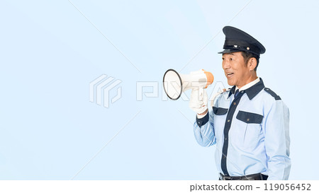 A male security guard using a megaphone to guide people A male security guard using a megaphone to guide people 119056452