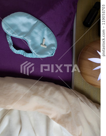 A woman cannot fall asleep and wants to drink a capsule with melatonin, a sleeping pill. Manifestations of jitlag or insomnia. Regulation of biological rhythms 119058703