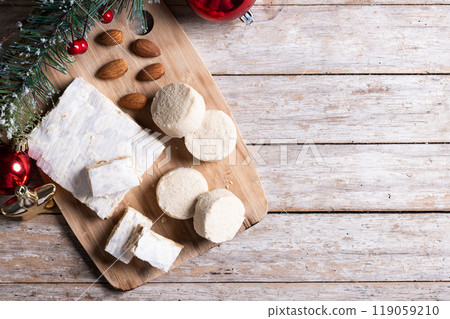 Christmas almond nougat and shortbread on wooden table 119059210
