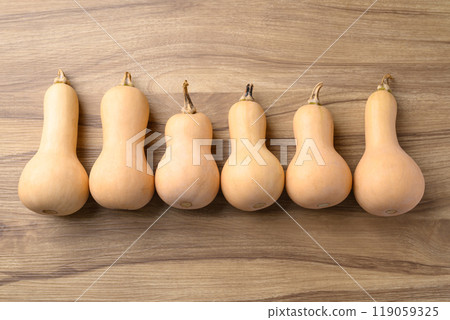 Butternut squash pumpkin on wooden background, Table top view 119059325
