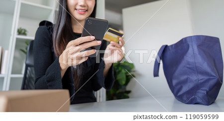 Online Shopper Making Purchase with Smartphone and Card from Home 119059599
