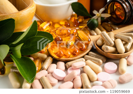 Alternative medicine herbal organic capsule with vitamin E omega 3 fish oil, mineral, drug with herbs leaf natural supplements for healthy good life. Alternative medicine herbal organic capsule with vitamin E omega 3 fish oil, mineral, drug with herbs leaf natural supplements for healthy good life. 119059669