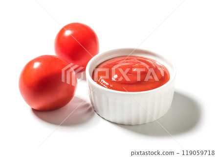 Ripe tomatoes and ketchup on white close up 119059718