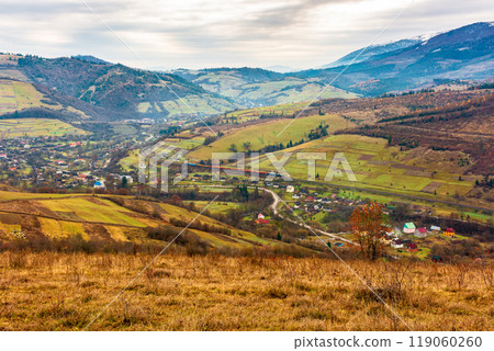 rural mountain landscape in november. late autumn scenery with snow capped peaks of carpathian mountains. fall season in ukraine rural mountain landscape in november. late autumn scenery with snow capped peaks of carpathian mountains. fall season in ukraine 119060260