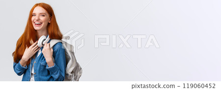 Education, student life and happiness concept. Cheerful good-looking redhead caucasian girl, college student with backpack and headphones over neck laughing smiling at camera 119060452