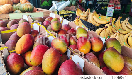 An assortment of exotic tropical fruits such as pumpkin, bananas, mango, chestnuts, and pineapple at the Madeira Island Food Market in Portugal An assortment of exotic tropical fruits such as pumpkin, bananas, mango, chestnuts, and pineapple at the Madeira Island Food Market in Portugal 119060641