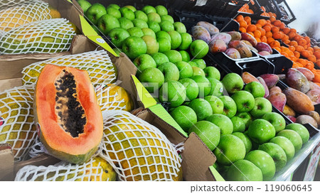 An assortment of exotic tropical fruits such as pitaya, dragon fruit, bananas, mango, chestnuts, and at the Madeira Island Food Market in Portugal An assortment of exotic tropical fruits such as pitaya, dragon fruit, bananas, mango, chestnuts, and at the Madeira Island Food Market in Portugal 119060645