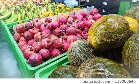 An assortment of exotic tropical fruits such as bananas, pomegranate, melon, mango, at the Madeira Island Food Market in Portugal 119060646
