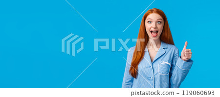 Excited impressed and overwhelmed young silly pretty redhead female in nightwear screaming in thrill and amazement found exactly what looking for show thumbs-up in approval, like or recommendation Excited impressed and overwhelmed young silly pretty redhead female in nightwear screaming in thrill and amazement found exactly what looking for show thumbs-up in approval, like or recommendation 119060693