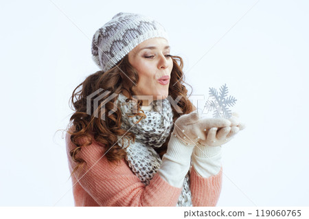 trendy woman in sweater, mittens, hat and scarf on trendy woman in sweater, mittens, hat and scarf on 119060765