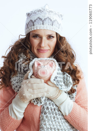 modern woman in sweater, mittens, hat and scarf on white modern woman in sweater, mittens, hat and scarf on white 119060773