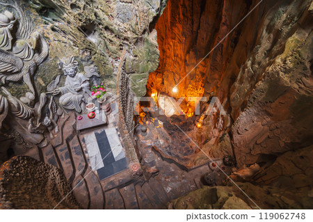 interior of deep large Am Phu cave with a Buddhist temple and sacred statues inside in Marble Mountains in Da Nang in Vietnam 119062748
