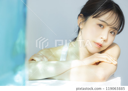 A woman by the window 119063885