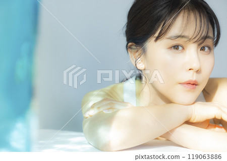 A woman by the window 119063886