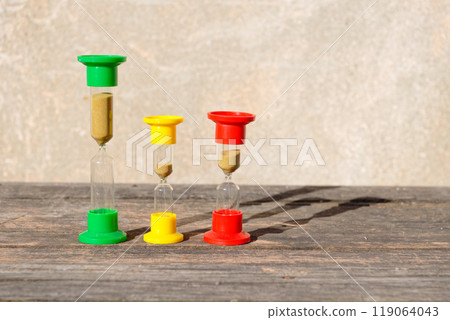 Hourglasses on rustic wooden table Hourglasses on rustic wooden table 119064043