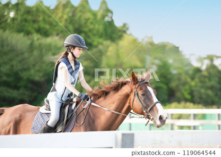 Girls enjoying horseback riding Girls enjoying horseback riding 119064544