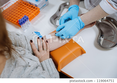 Healthcare professional drawing blood from patient for medical test. Laboratory and diagnostics 119064751